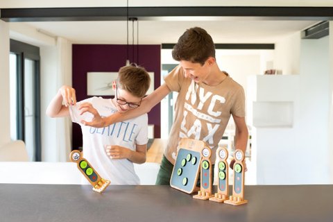 2 guys wrestle in fun for the best household tasks on the taskboard